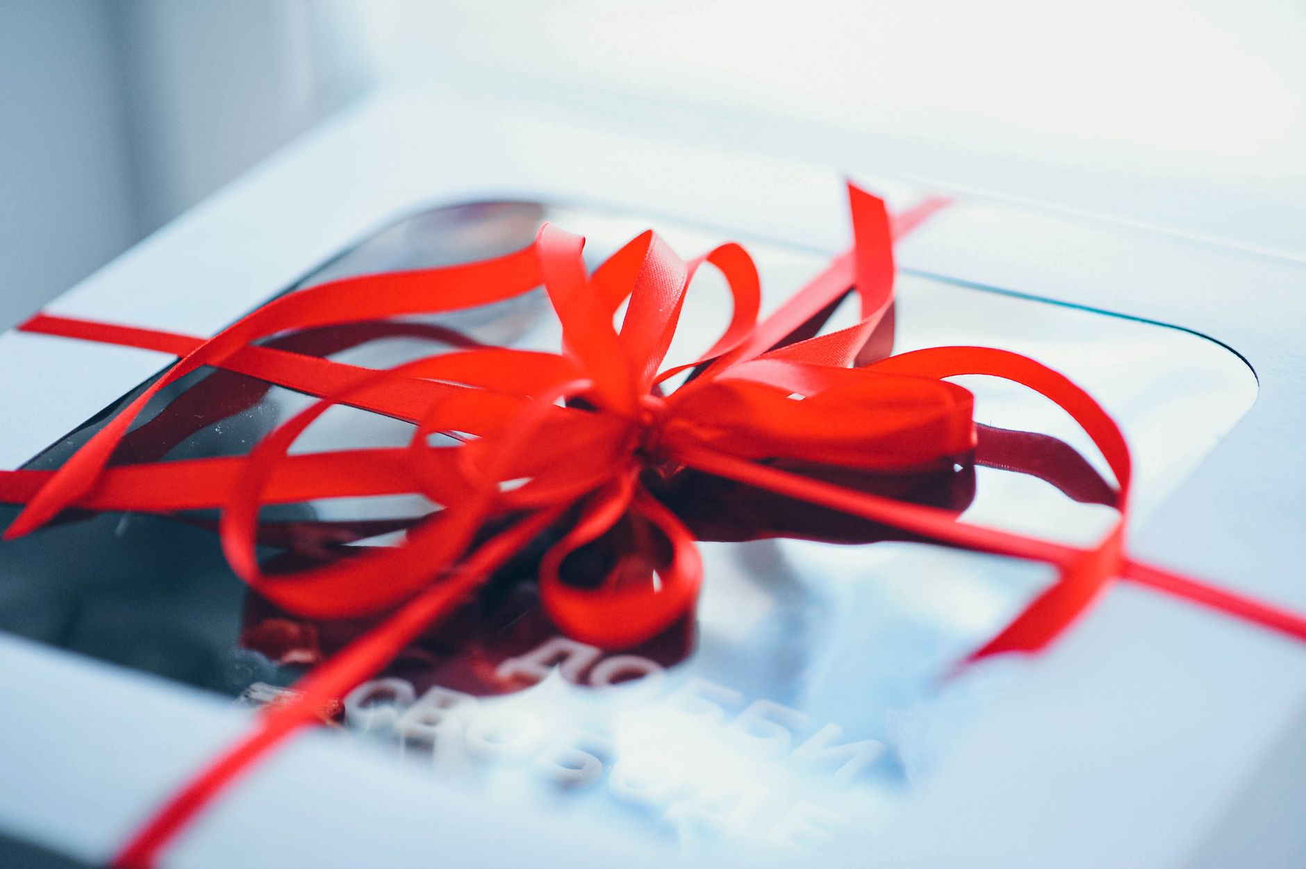 Gift wrapping with a red ribbon